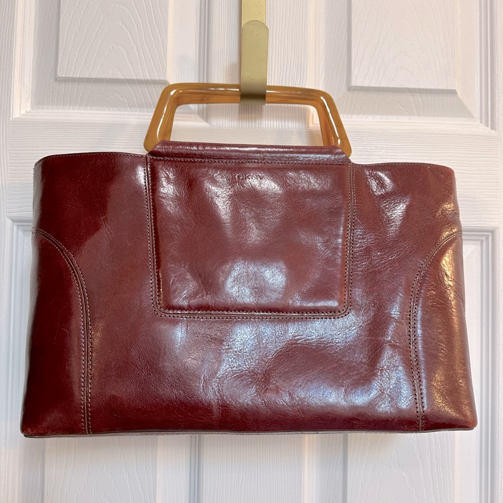 DKNY burgundy top handle leather bag.